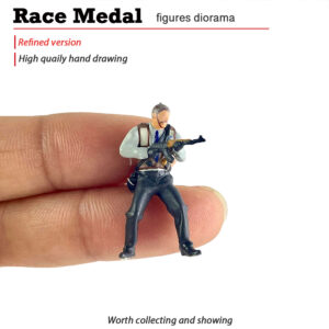 T Suited Professional miniature figure held on a fingertip